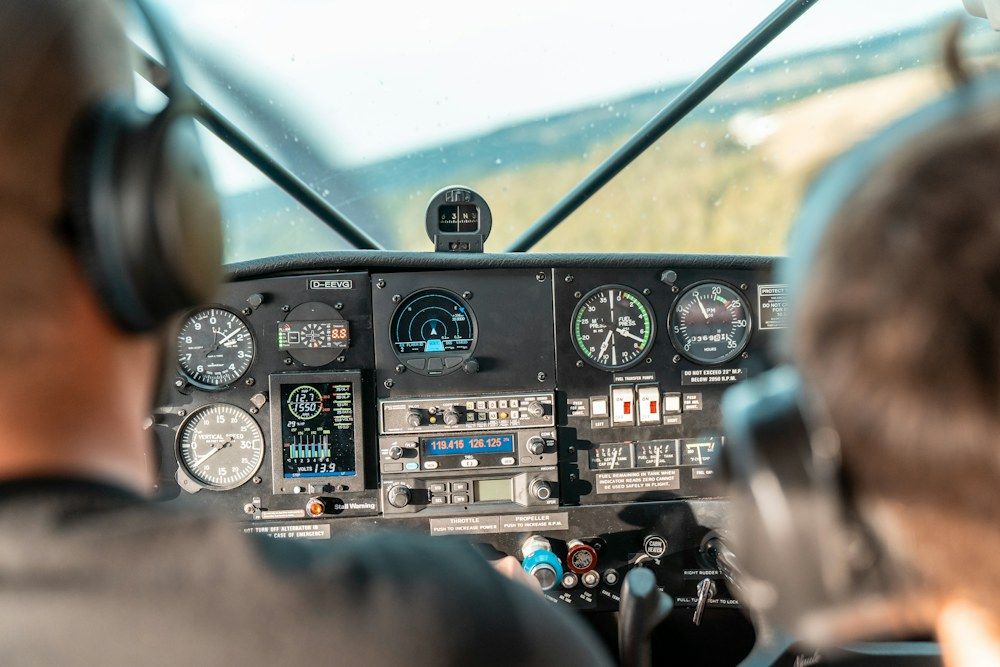 A high-resolution Unsplash photograph by Lorin Both captures the intimate environment of a light aircraft cockpit.
