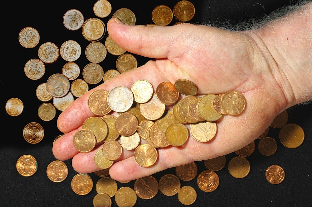 Coins held in an open hand