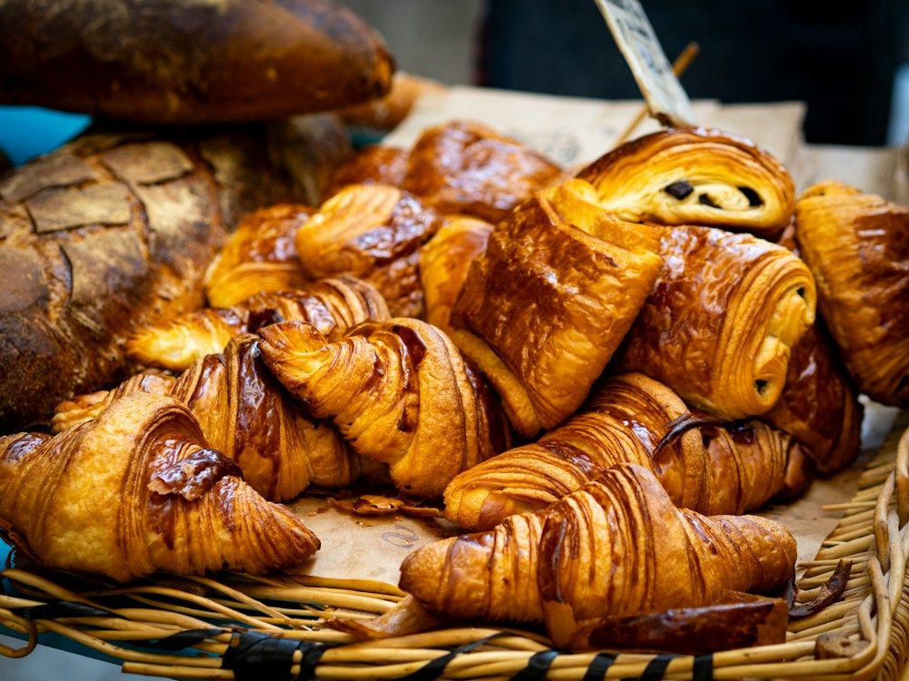 Basket of croissants and assorted pastries