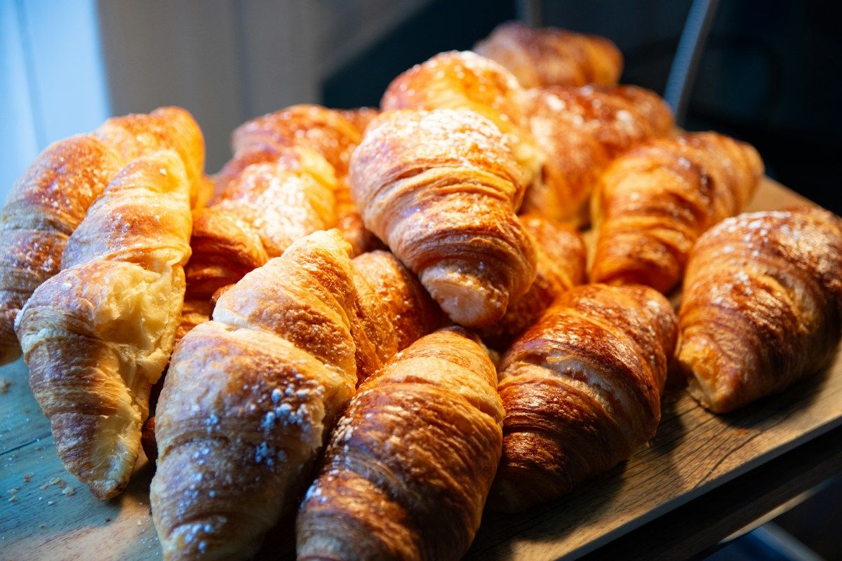 Sugar-dusted croissants at a bakery