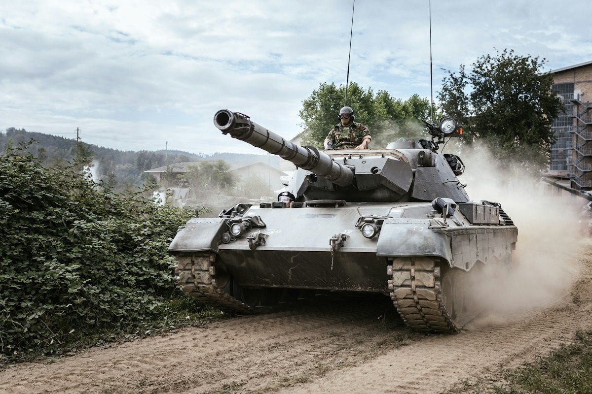 Tank moving along a dirt road