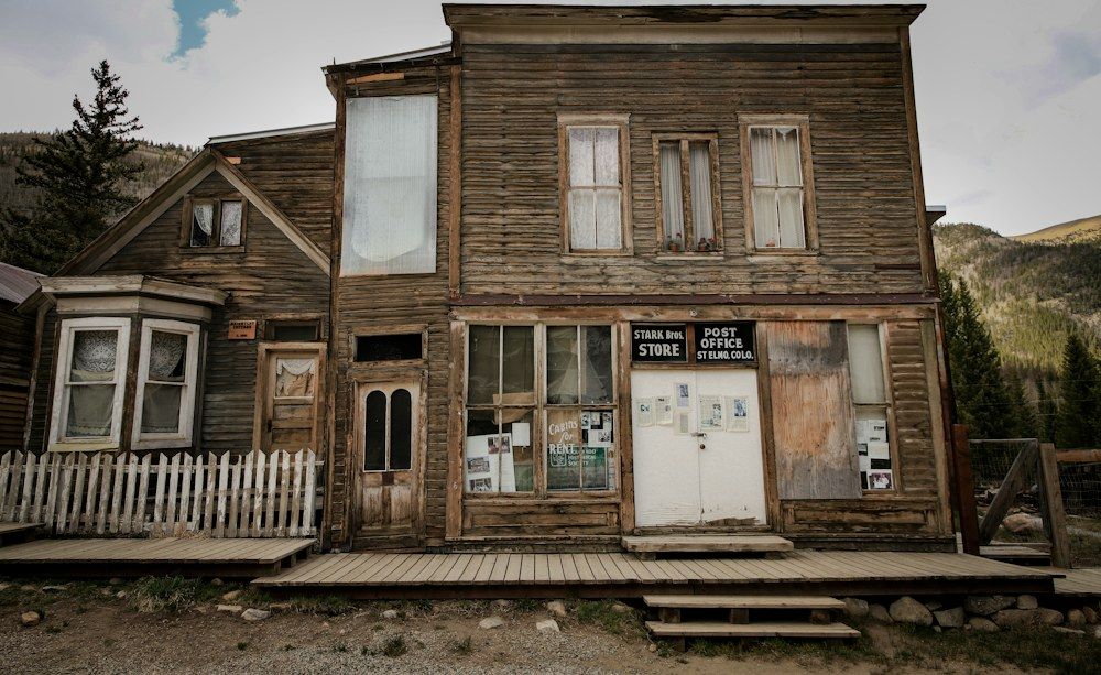 Old buildings line an empty street in a small town.