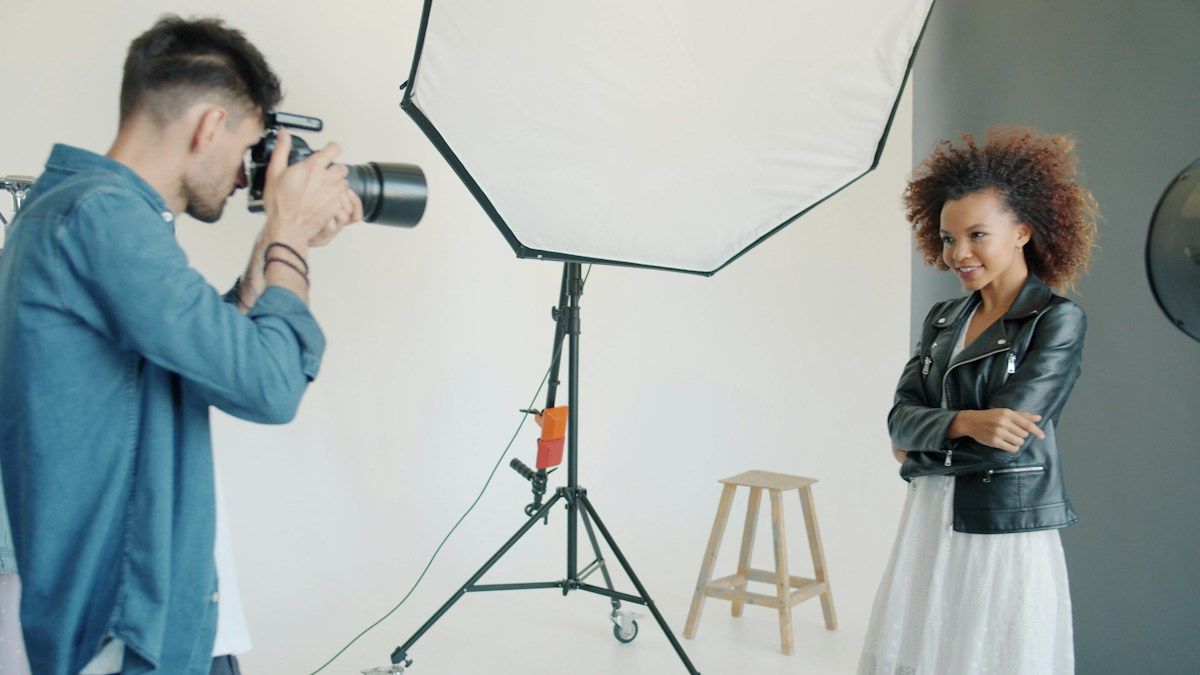 Photographer shooting a portrait using a softbox