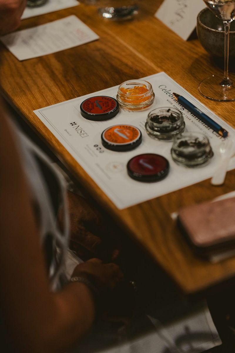 Wine tasting setup with various colorful samples.