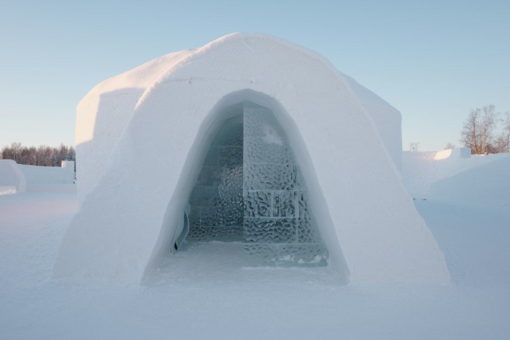Ice hotel entrance in snow