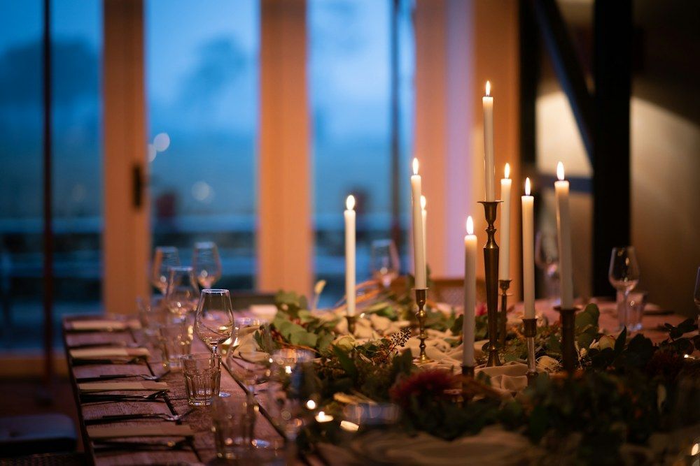 A table with a lot of candles on it