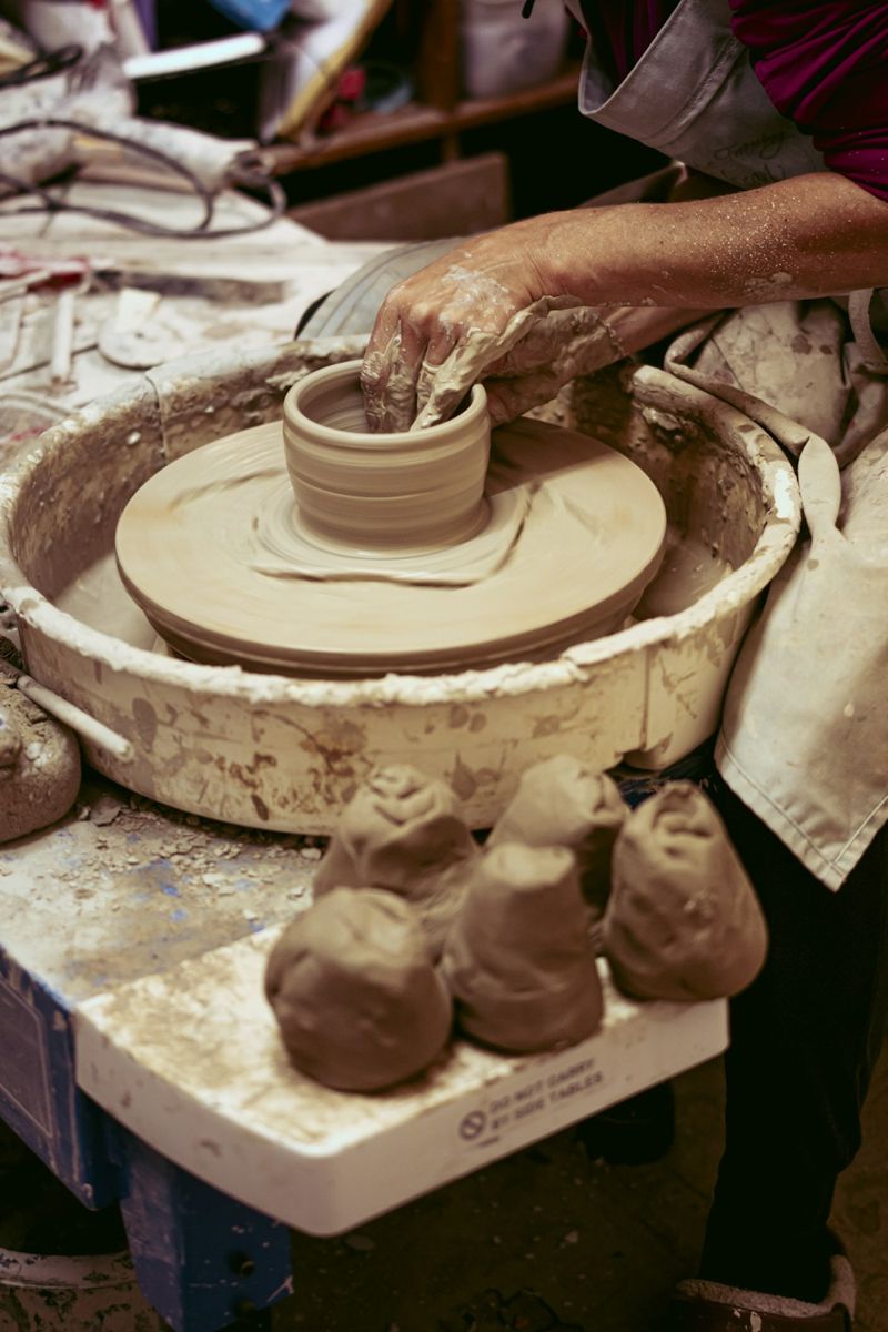 A person is making clay on a wheel