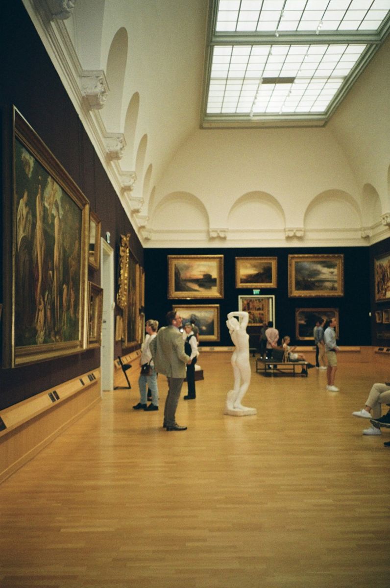 People viewing art in a museum gallery