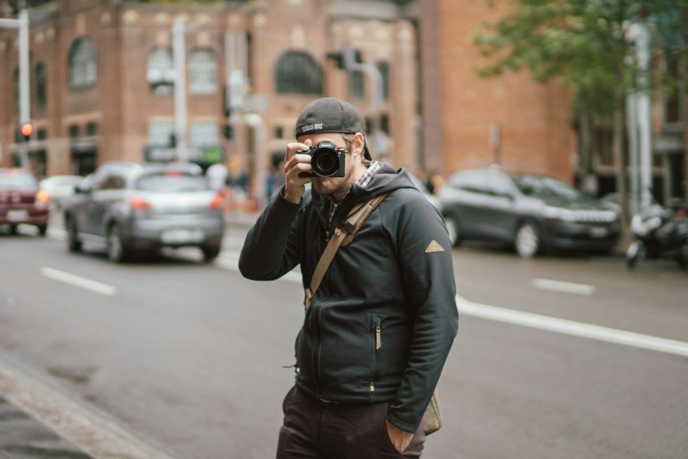 Photographer taking a picture on an urban street