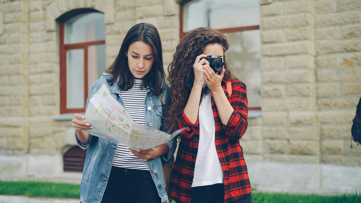 Two friends explore the city with a camera