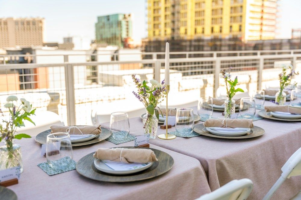 Dinner table set on a rooftop terrace