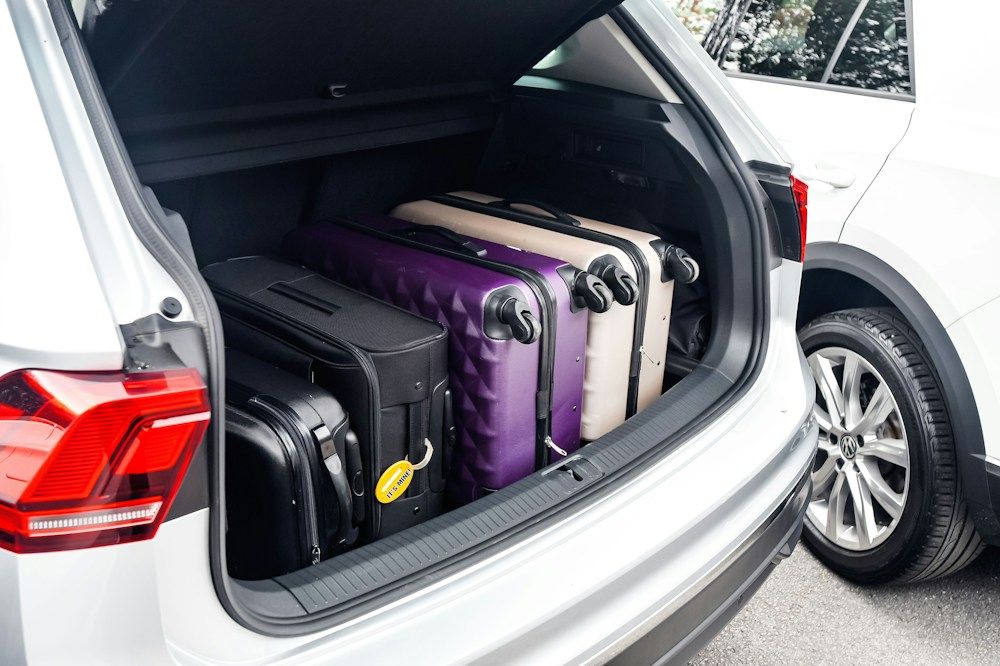 Car trunk packed with suitcases
