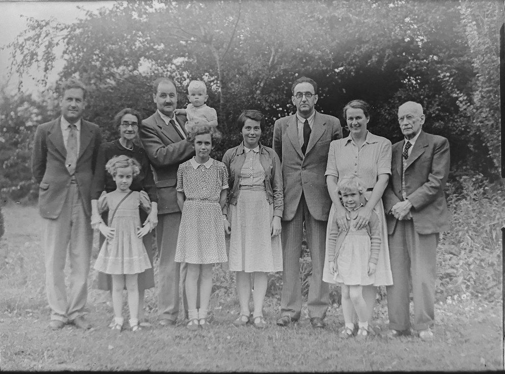 Black and white vintage multigenerational family portrait outdoors