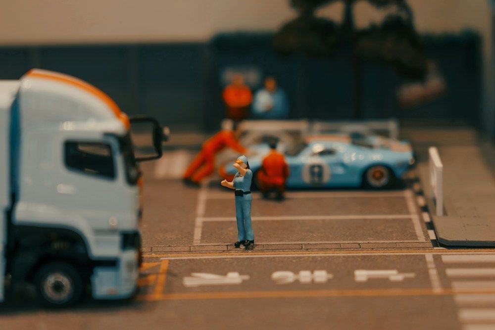 Miniature pit stop scene with a race car