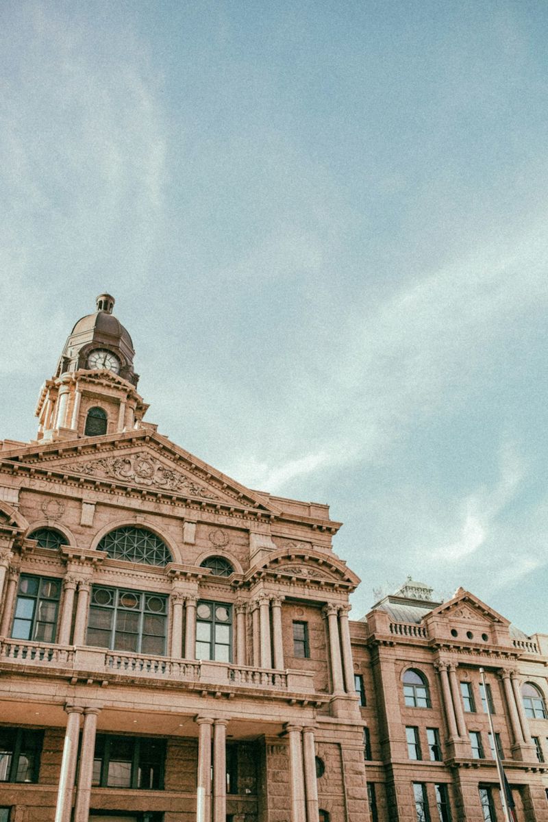 Historic courthouse with a clock tower against sky