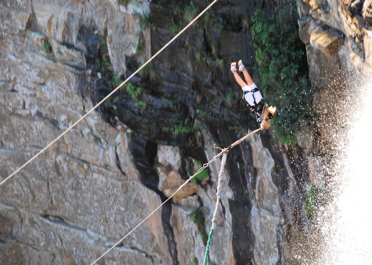 Harnessed participant suspended over Oribi Gorge