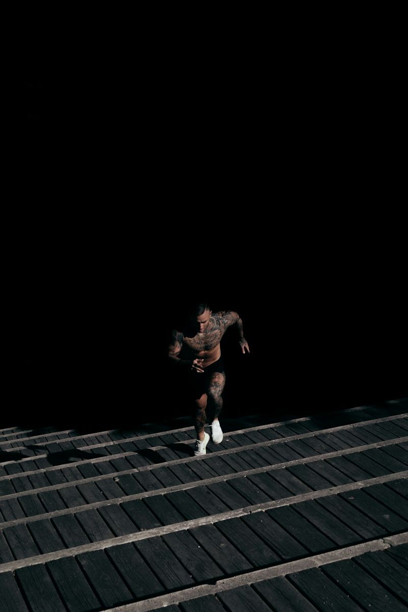 Athlete running up a staircase.