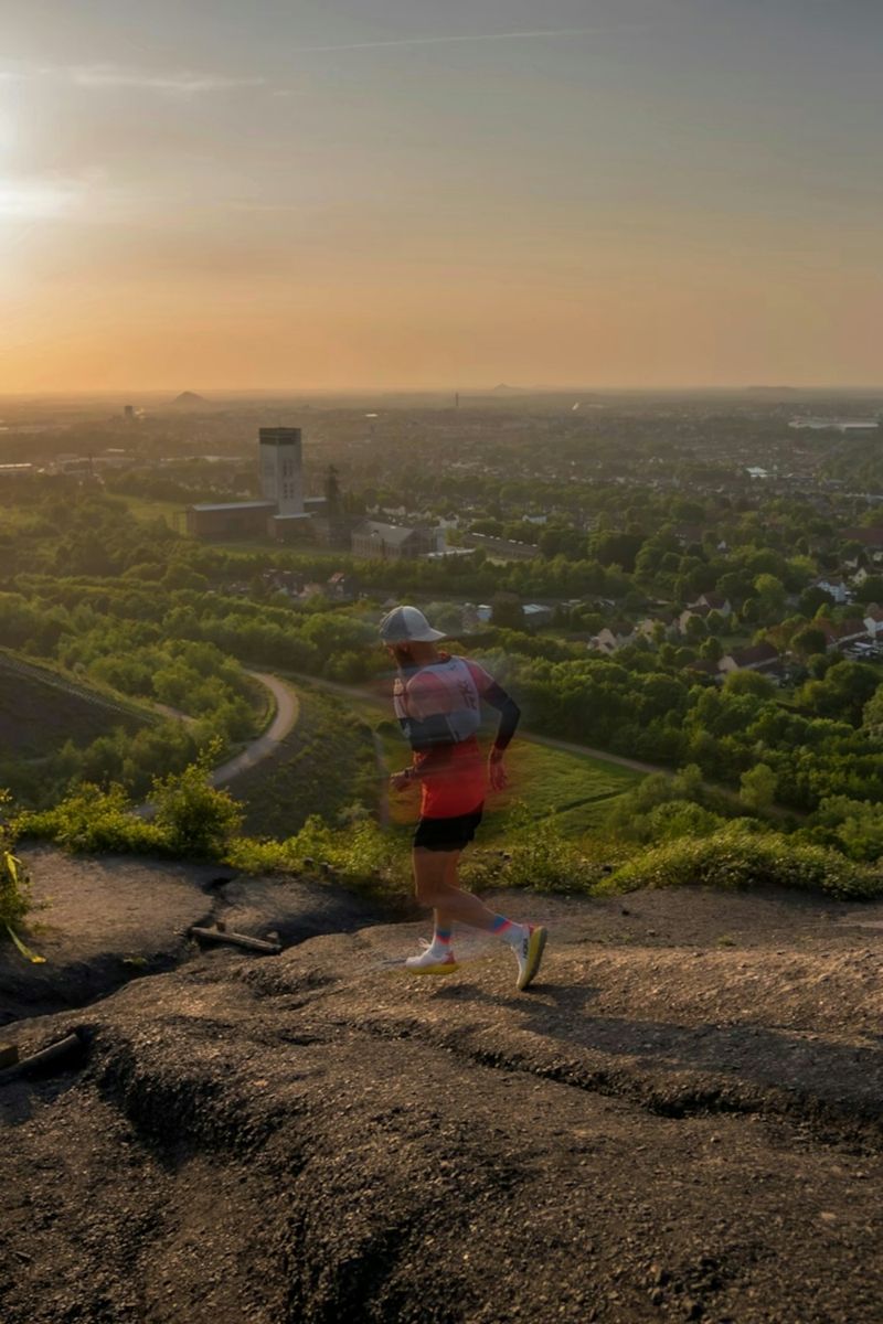 Runner following a rocky outdoor trail
