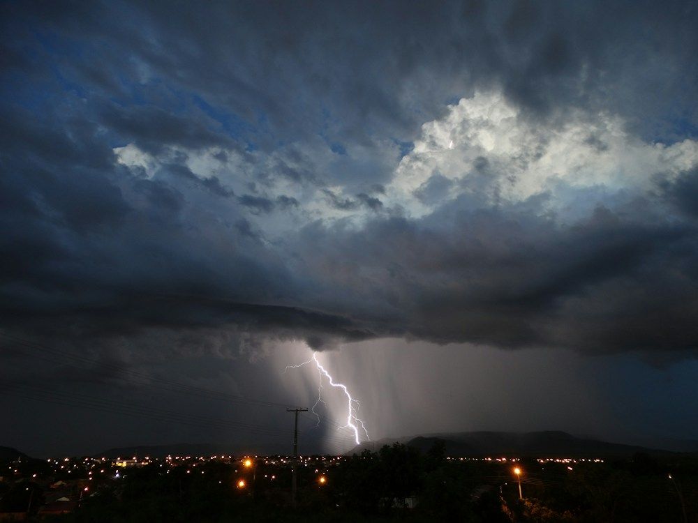 Lightning beneath dark storm clouds