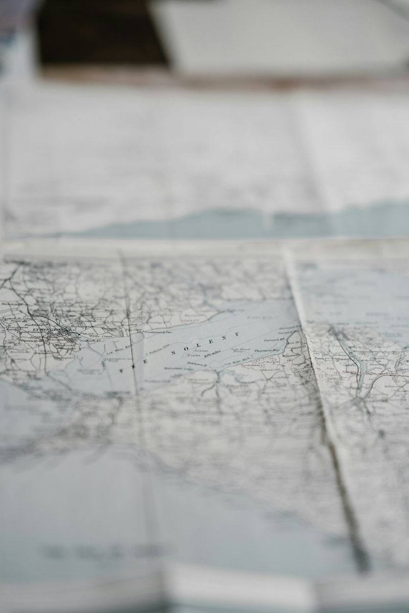 Paper maps spread on a table