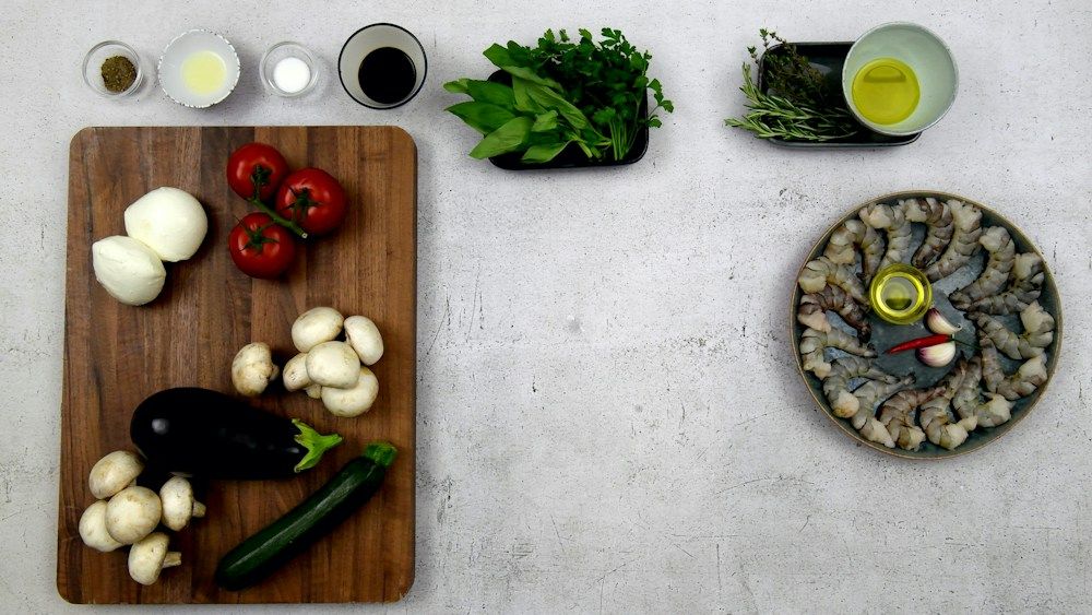 Cooking ingredients including vegetables, herbs and shrimp