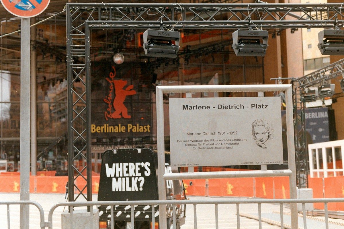 Festival stage set up with a sign in front