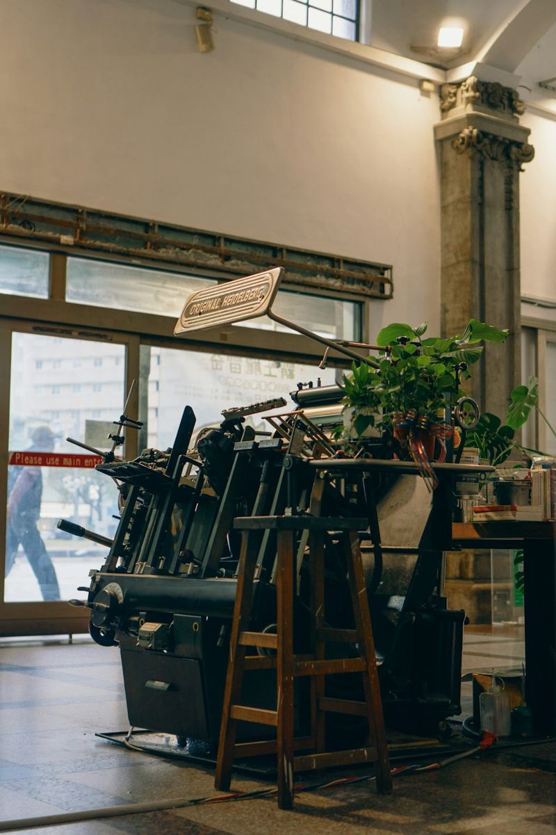 Vintage Heidelberg printing press in a printing workshop.