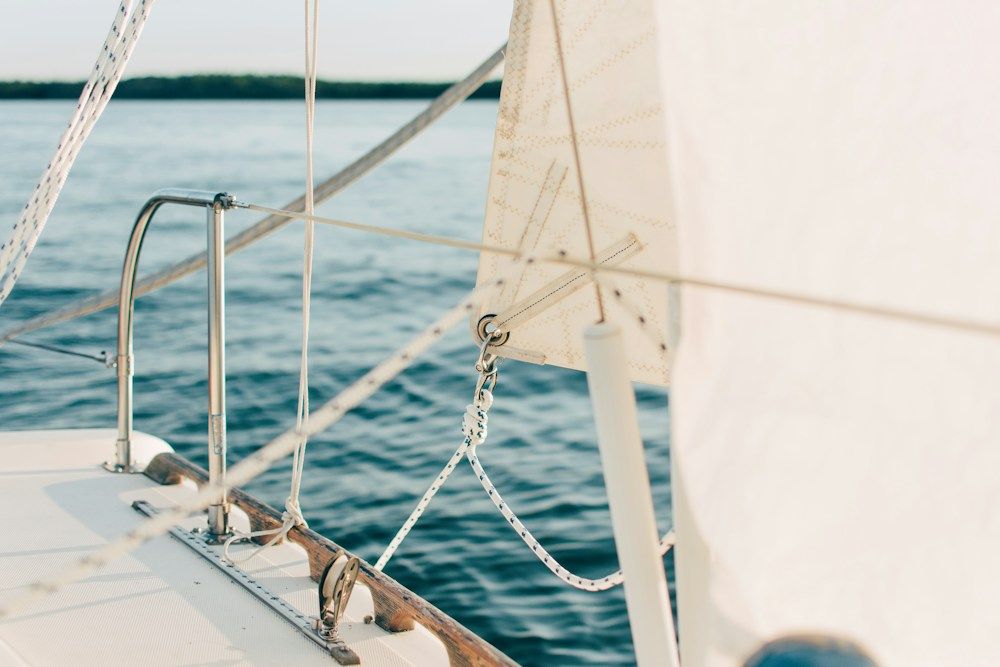 Sailboat rigging and ropes on calm water