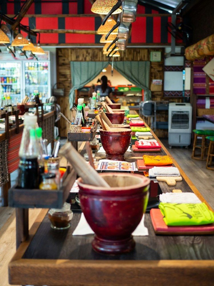 Cooking stations and ingredients in a Thai cooking class