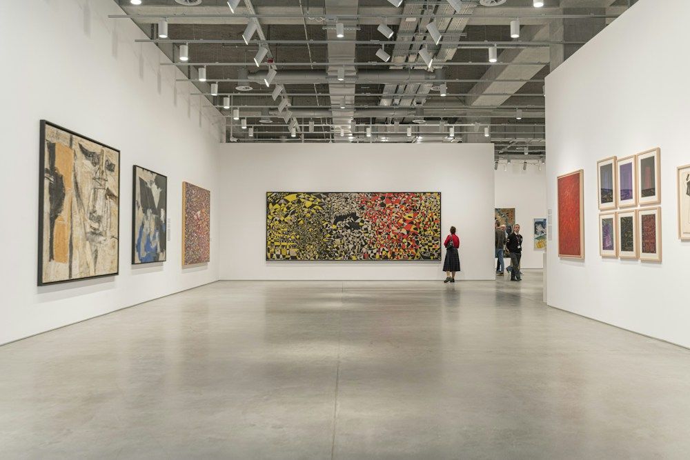 People exploring contemporary art gallery
