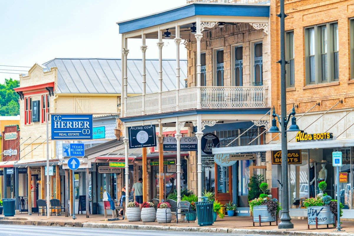 Historic storefronts line a charming small-town street