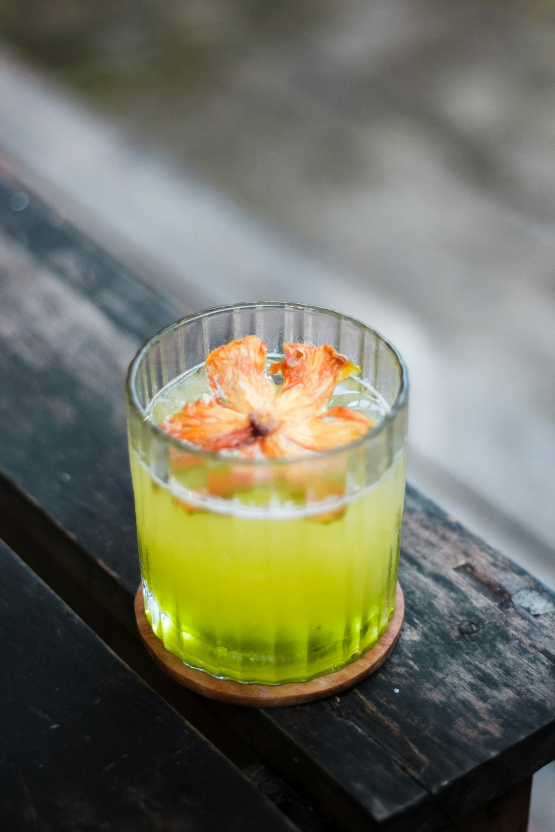 A green citrus drink on a wooden table